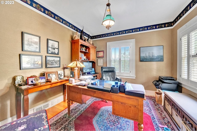 office space featuring wood-type flooring and ornamental molding