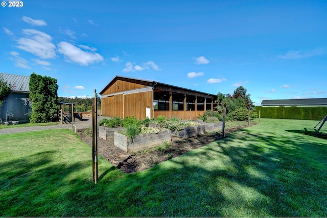 view of outbuilding featuring a lawn