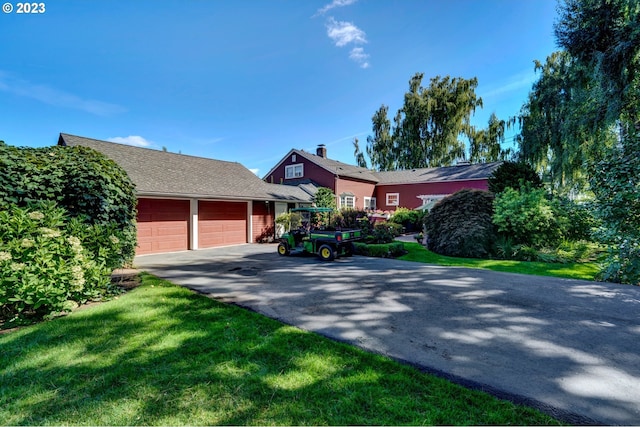 ranch-style house with a front lawn and a garage