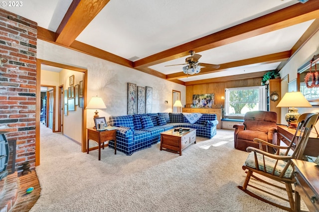 living room featuring light colored carpet, ceiling fan, and beam ceiling