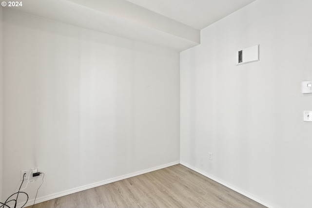 spare room featuring light hardwood / wood-style floors