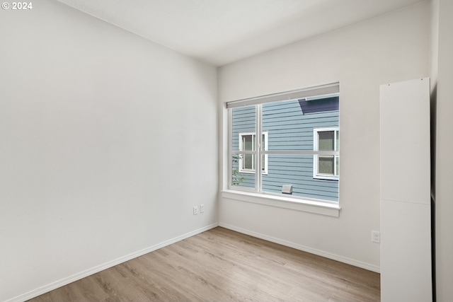 unfurnished room featuring light hardwood / wood-style flooring