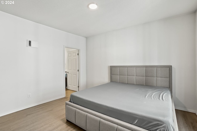 bedroom featuring light wood-type flooring