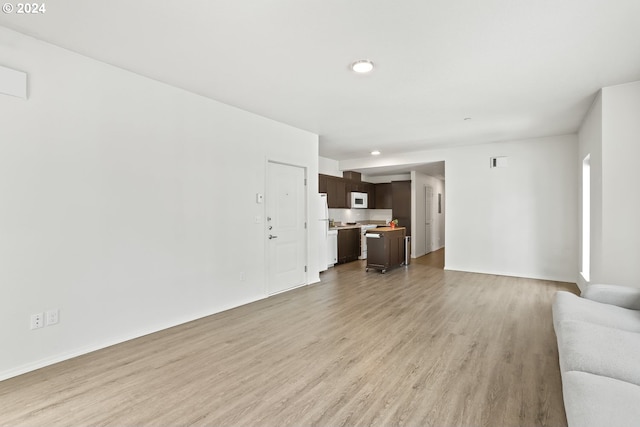 unfurnished living room featuring light hardwood / wood-style floors