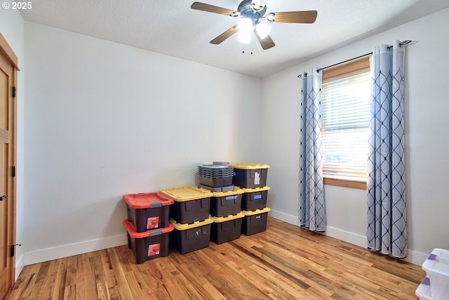 interior space featuring ceiling fan