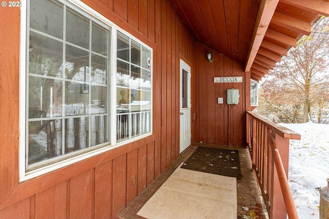 view of snow covered property entrance