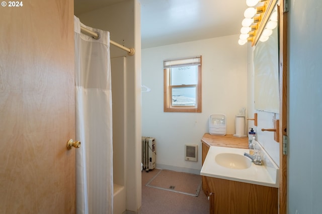 bathroom with vanity, radiator heating unit, and heating unit