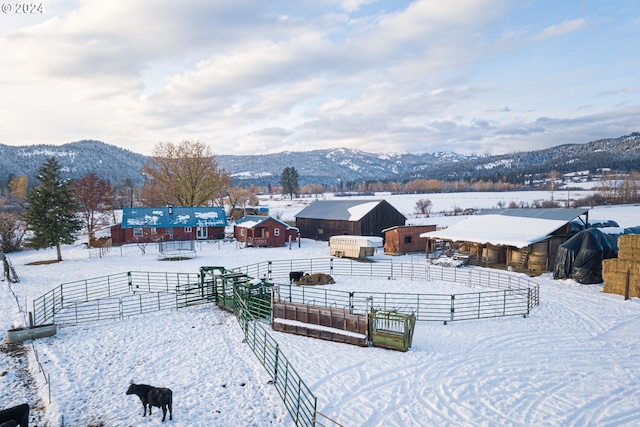 snowy aerial view featuring a mountain view