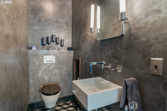 bathroom with sink, tile patterned floors, and toilet