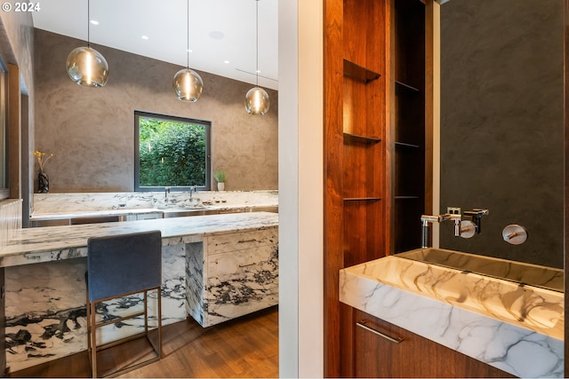 bathroom featuring wood-type flooring and sink