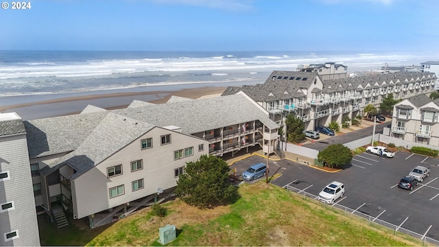 bird's eye view with a beach view and a water view