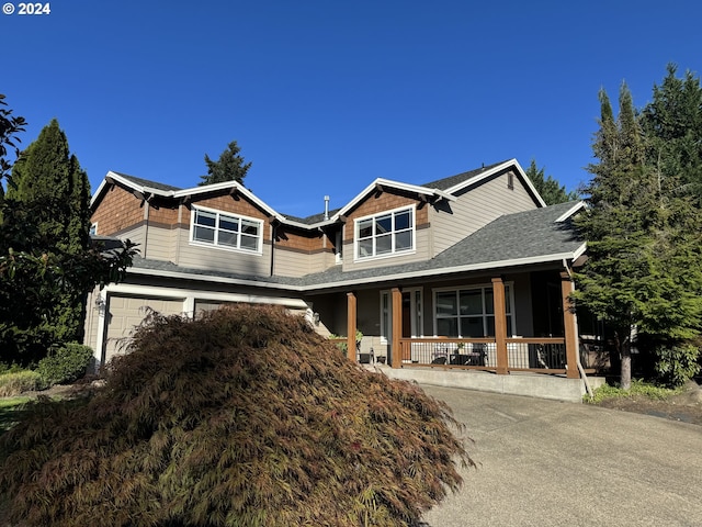 craftsman house featuring a garage and covered porch