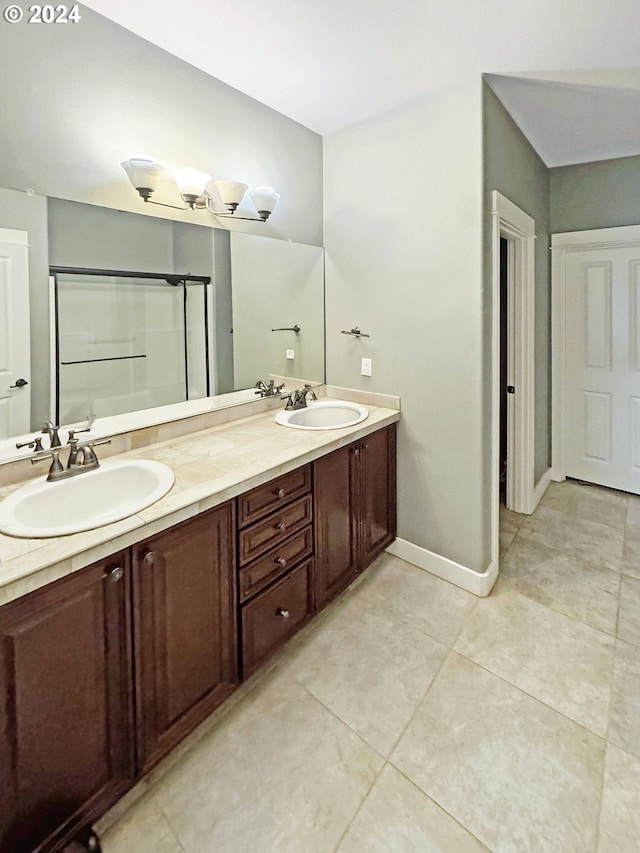 bathroom with vanity, tile patterned floors, and a shower with shower door