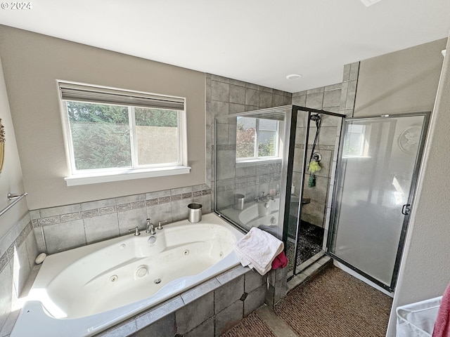 bathroom with independent shower and bath and tile patterned flooring