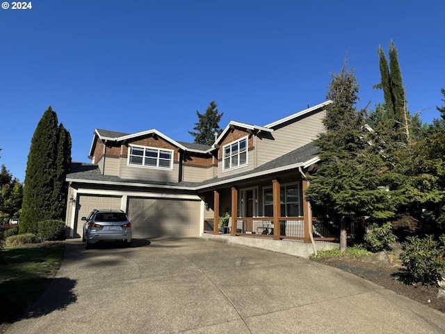 view of front of home with a garage and covered porch