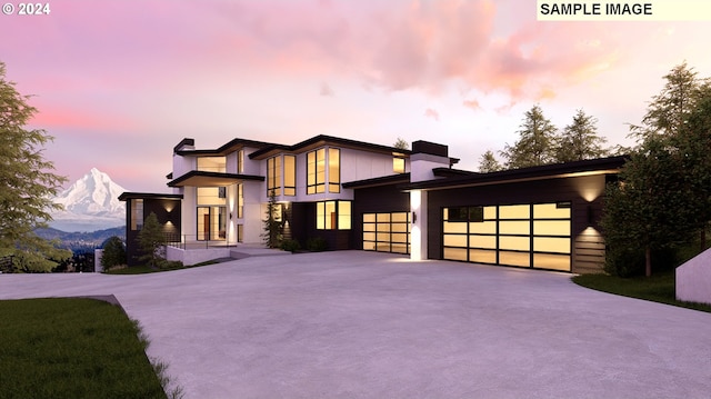 contemporary house featuring a garage and a mountain view