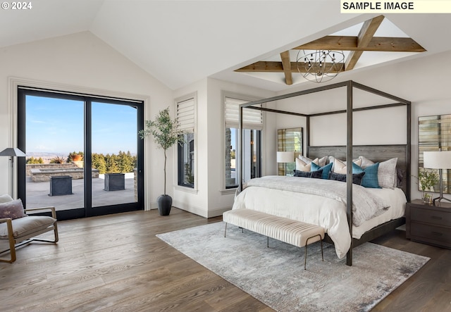 bedroom with a chandelier, multiple windows, hardwood / wood-style floors, and access to exterior