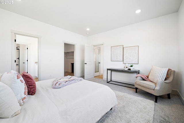 1588 NE 8th Pl, Hermiston, OR 97838 - bedroom featuring a walk in closet, recessed lighting, light colored carpet, and a closet