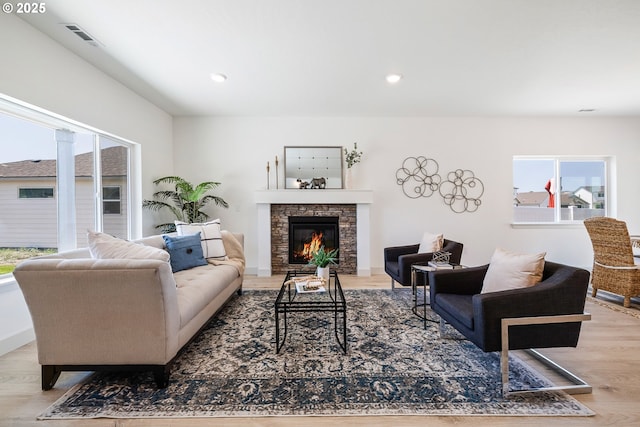1588 NE 8th Pl, Hermiston, OR 97838 - living room with plenty of natural light, a stone fireplace, wood finished floors, and recessed lighting