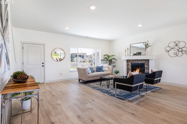 1588 NE 8th Pl, Hermiston, OR 97838 - living area with wood finished floors, a stone fireplace, and recessed lighting