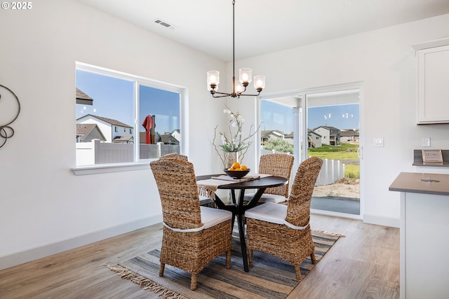 1588 NE 8th Pl, Hermiston, OR 97838 - dining space with light wood finished floors and a chandelier