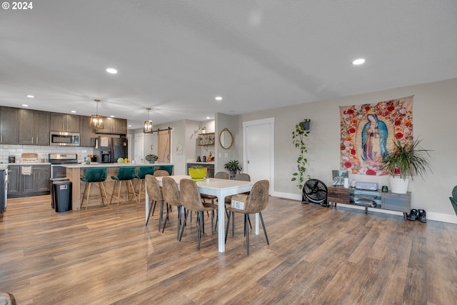 dining space with light hardwood / wood-style floors