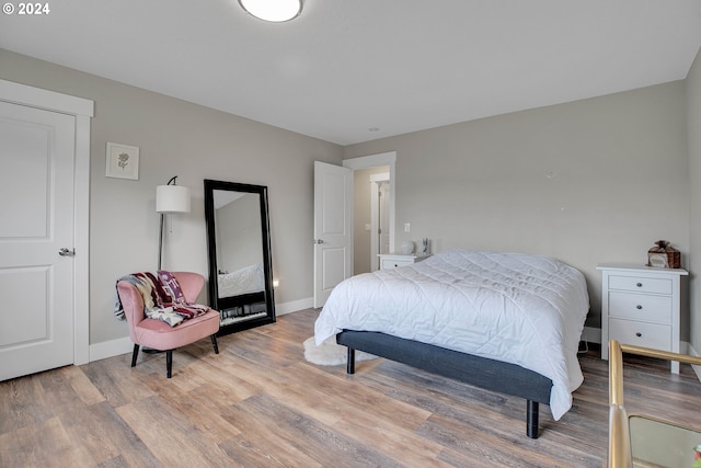 bedroom with light hardwood / wood-style flooring