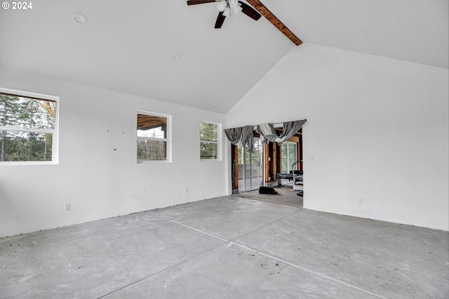 interior space with ceiling fan, beamed ceiling, concrete flooring, and high vaulted ceiling