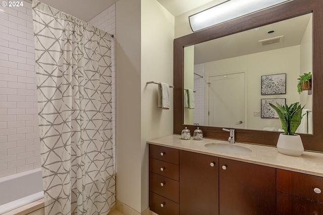 bathroom featuring shower / tub combo with curtain and vanity