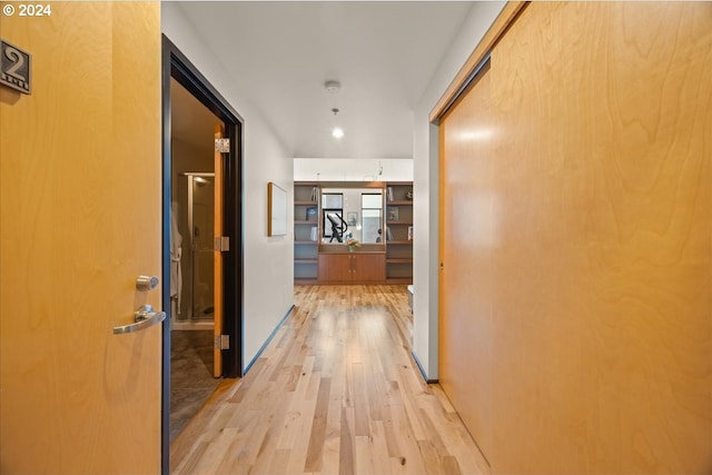 hallway with light wood-type flooring