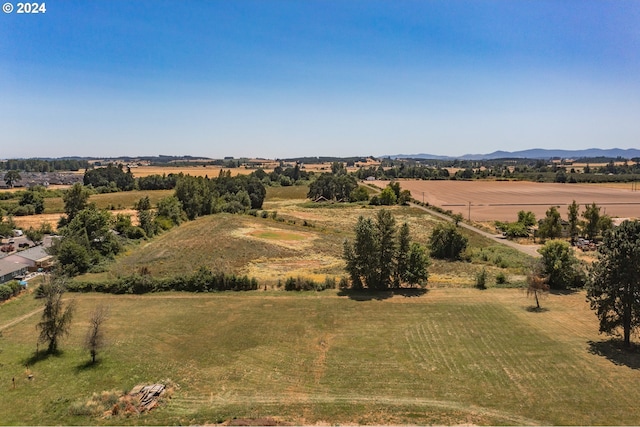 bird's eye view featuring a rural view and a mountain view