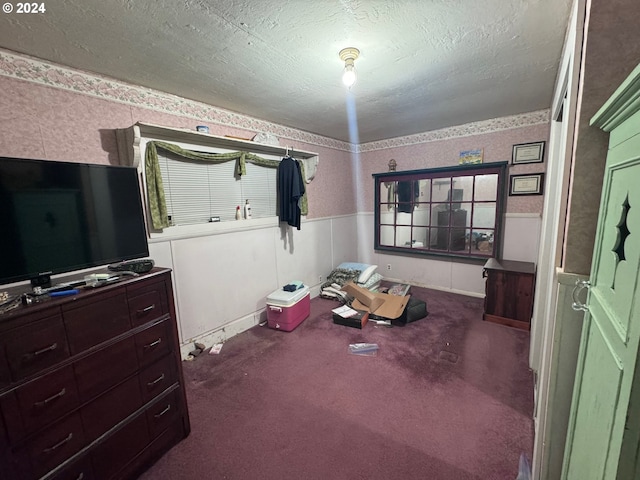 carpeted bedroom featuring a textured ceiling