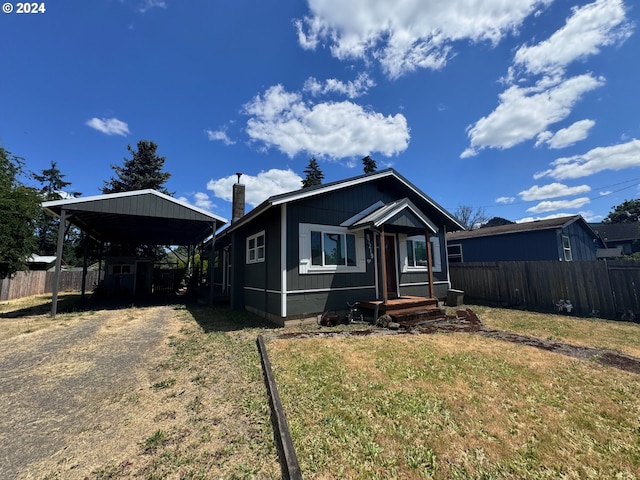 view of front of house featuring a front yard and a carport