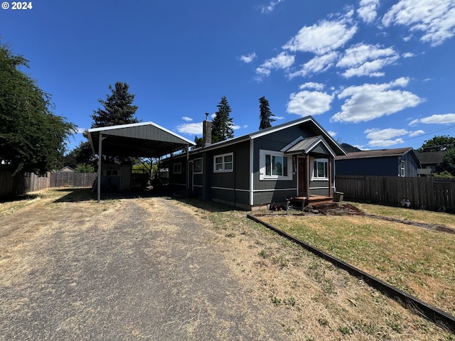 view of front of home featuring a carport