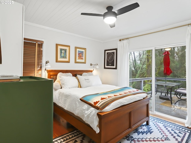 bedroom with hardwood / wood-style floors, ceiling fan, access to exterior, and ornamental molding