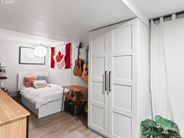 bedroom with light wood-type flooring