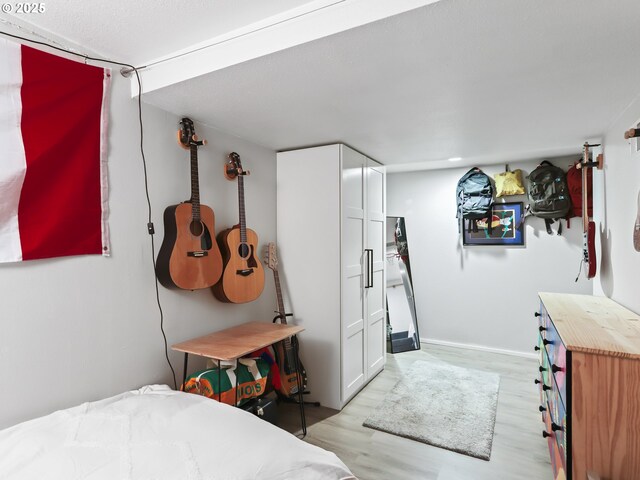 bedroom with light wood-type flooring