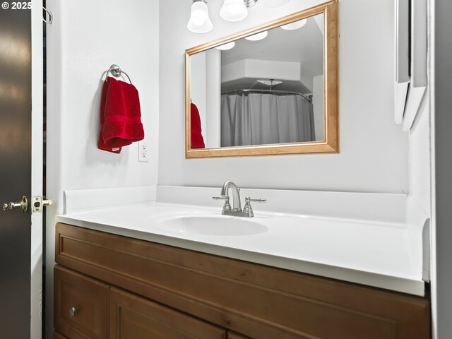 bathroom featuring vanity and walk in shower