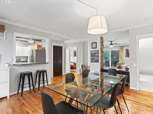 dining room featuring ceiling fan, light hardwood / wood-style flooring, and wooden ceiling