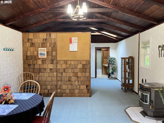 carpeted dining space with a wood stove, lofted ceiling with beams, wood ceiling, and an inviting chandelier