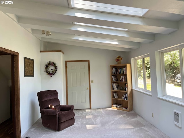 living area featuring heating unit, carpet, and lofted ceiling