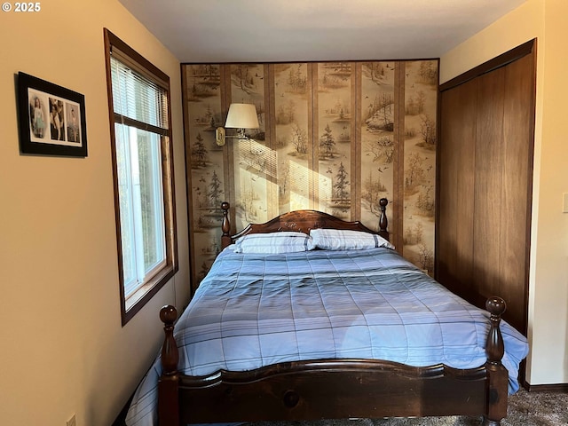 bedroom featuring carpet and a closet