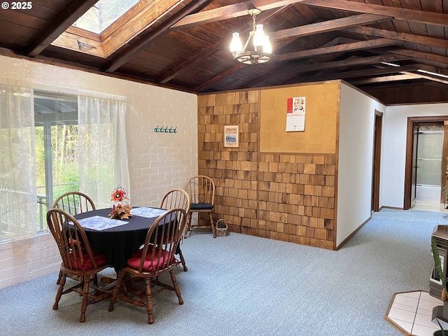 dining area featuring light carpet, vaulted ceiling with beams, wood ceiling, and brick wall