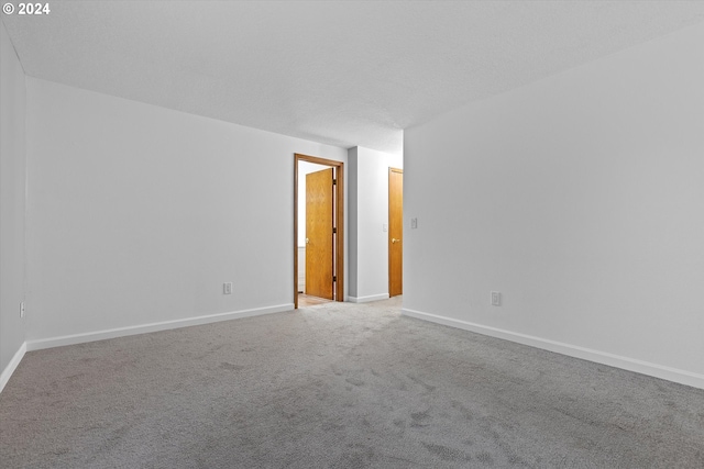 unfurnished room with carpet floors