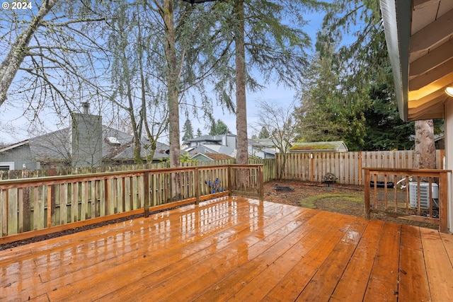 wooden terrace featuring central AC unit