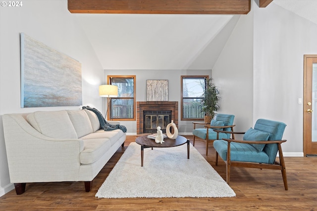 living room featuring high vaulted ceiling, hardwood / wood-style floors, beam ceiling, and a fireplace