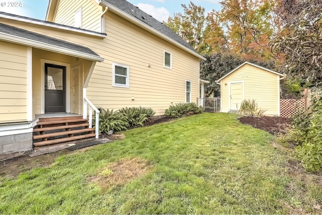 view of yard with an outbuilding and a storage shed