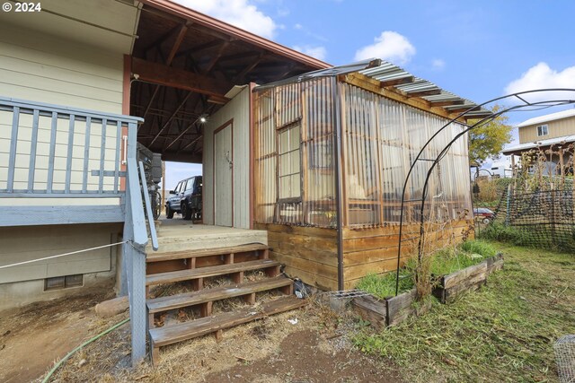 view of property exterior featuring an outbuilding