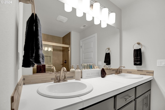 bathroom with vanity and an enclosed shower