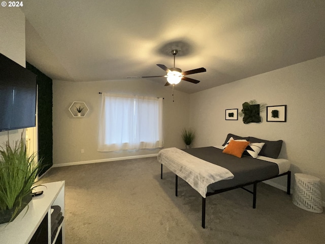 bedroom featuring ceiling fan, carpet floors, and vaulted ceiling